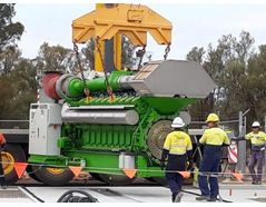 One of two 3MW, 20 cylinder gas engines is safely lowered into position