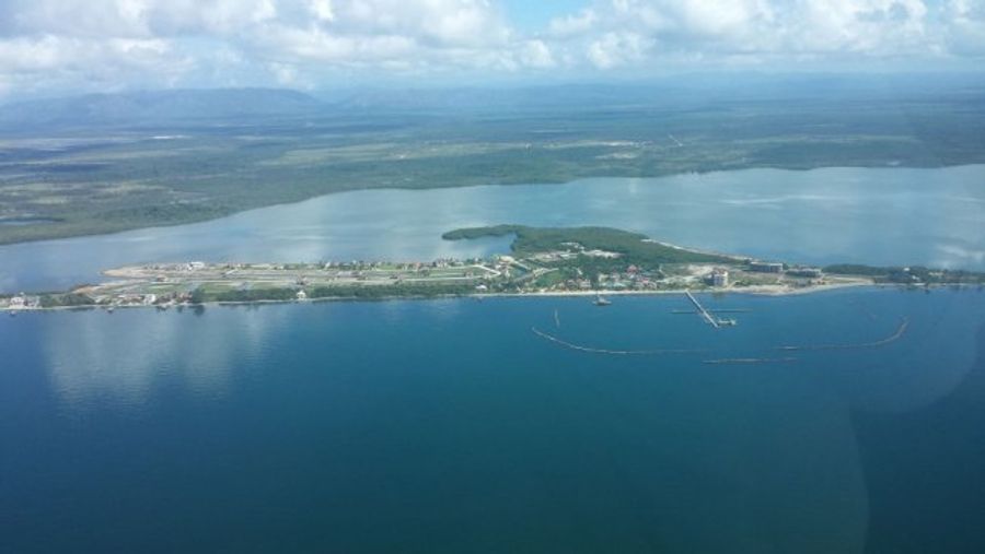 Placencia peninsula, Belize (looking west). Natcore has been engaged to oversee development of a 10 MW power system on a site across the lagoon from the peninsula.