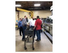 Scott Hoffman discusses a recent process improvement with employees of the Fisher Barton Zenith Cutter Division