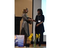 ASES Executive Director, Carly Rixham, handing out the Passive Pioneer award to Alison Kwok at SOLAR 2017 in Denver, CO.