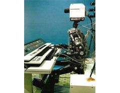 1980: WABOT-2 was built at Waseda University. This inception of the WABOT allowed the humanoid to communicate with people as well as read musical scores and play music on an electronic organ. (Reproduced from [1])