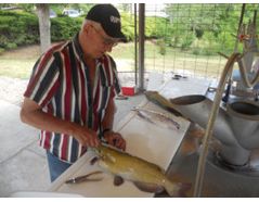 This angler was one of the first to fillet his fish and dispose of the carcass in the new grinder.