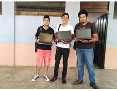 Youths taking part in the AHMEN program receiving the refurbished laptops sponsored by Peak