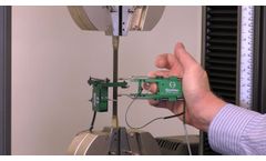 Transverse extensometer installation on a composite specimen to measure Poisson’s ratio (Model 3575) - Video