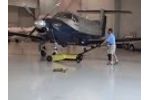 An aircraft tow pulls large aircraft in an airplane hangar Video
