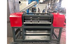 Radiator stripping machine