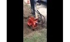 NPK C2D Plate Compactor / Driver on Deere 27D - Compacting Soil Video