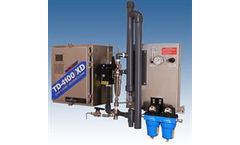 UV fluorescence technology for monitoring oil in power plant cooling water