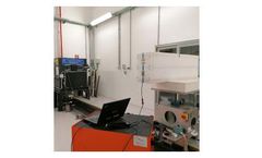 Feasibility study of a shielding-independent radiation portal monitor system for revealing 241-Am orphan sources in radiometric surveillance of scrap metal